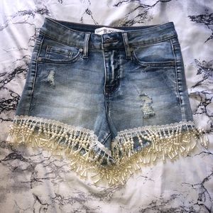 Denim shorts with lace and beading at the bottom